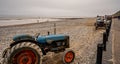 Tow tractor parked up on the shingle beach on the Norfolk coast