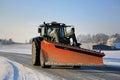 Tractor and Snow Plow on the Road