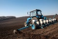 Tractor with sower on the field