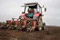 Tractor sowing field in spring time Royalty Free Stock Photo