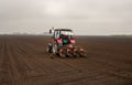 Tractor sowing field in spring time Royalty Free Stock Photo