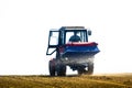 Tractor Spaying a field in the spring Royalty Free Stock Photo