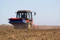 Tractor Spaying a field in the spring Royalty Free Stock Photo