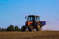 Tractor Spaying a field in the spring Royalty Free Stock Photo