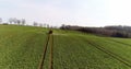 Tractor spray fertilize on field with chemicals in agriculture field. Royalty Free Stock Photo