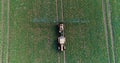 Tractor spray fertilize on field with chemicals in agriculture field. Royalty Free Stock Photo