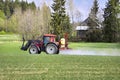 Tractor and Sprayer in Field in the Spring Royalty Free Stock Photo