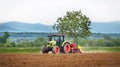 Tractor spraying field.