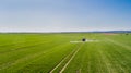 Tractor Spraying Herbicides on Field Agriculture