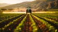 A tractor spraying pesticide on a field Royalty Free Stock Photo