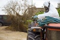 Tractor spraying pesticide and insecticide on lemon plantation in Spain. Weed insecticide fumigation. Organic ecological