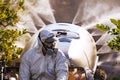 Tractor spraying pesticide and insecticide on lemon plantation in Spain. Weed insecticide fumigation. Organic ecological Royalty Free Stock Photo