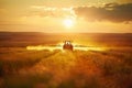 A tractor spraying pesticide on soybean farm at spring sunset.