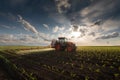 Tractor spraying corn field Royalty Free Stock Photo