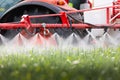 Tractor spraying pesticides wheat field Royalty Free Stock Photo