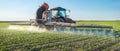 Tractor spraying pesticides