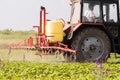 Tractor spraying pesticides at soy bean field Royalty Free Stock Photo