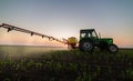 Tractor spraying pesticides at  soy bean field Royalty Free Stock Photo