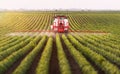 Tractor spraying pesticides on soybean field with sprayer at spring Royalty Free Stock Photo