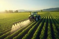 Tractor spraying pesticides on soybean field with sprayer at spring, Tractor spraying pesticides fertilizer on soybean crops farm Royalty Free Stock Photo