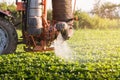 Tractor spraying pesticides on soybean field with sprayer at spring Royalty Free Stock Photo