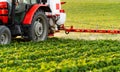 Tractor spraying soybean field at spring Royalty Free Stock Photo