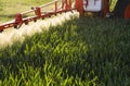 Tractor spraying pesticides wheat field Royalty Free Stock Photo