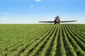 Tractor spraying soybean crop field Royalty Free Stock Photo