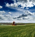 Tractor spraying soybean crops field Royalty Free Stock Photo