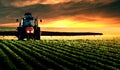 Tractor spraying soybean crops field Royalty Free Stock Photo