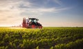 Tractor spraying soybean crops field Royalty Free Stock Photo