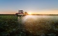 Tractor spraying soybean field Royalty Free Stock Photo