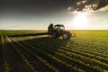 Tractor spraying soybean field at spring Royalty Free Stock Photo