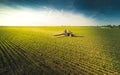 Tractor spraying soybean field at spring Royalty Free Stock Photo