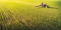 Tractor spraying soybean field at spring Royalty Free Stock Photo