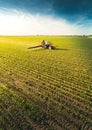 Tractor spraying soybean field at spring Royalty Free Stock Photo