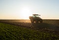 Tractor spreading artificial fertilizers Royalty Free Stock Photo