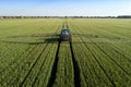 Tractor sprinkling pesticides Royalty Free Stock Photo