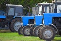Tractor, standing in a row. Agricultural machinery. Royalty Free Stock Photo