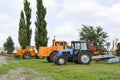 Tractor, standing in a row. Agricultural machinery. Royalty Free Stock Photo