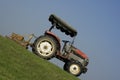 Tractor on a steep slope Royalty Free Stock Photo