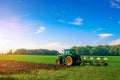 Tractor sunset. Agriculture farm machinery on landscape land field. Farmer machine equipment for crop. Combines