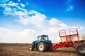 Tractor with tanks in the field. Agricultural machinery and farming