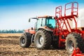 Tractor with tanks in the field. Agricultural machinery and farming. Royalty Free Stock Photo