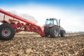 Tractor with tanks in the field. Agricultural machinery and farming.