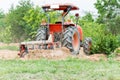 Tractor tilling in field