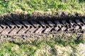 Tractor tire tracks in green grass Royalty Free Stock Photo