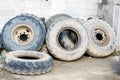 Tractor tires used sort of wall, smeared with mud