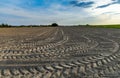 Tractor tracks on the harvested field Royalty Free Stock Photo