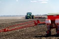 Tractor with trailed planter on the field